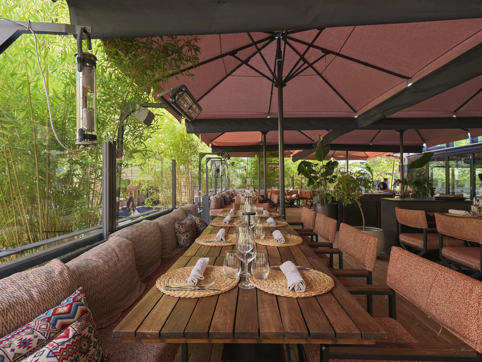 Terrace lounge under red parasols